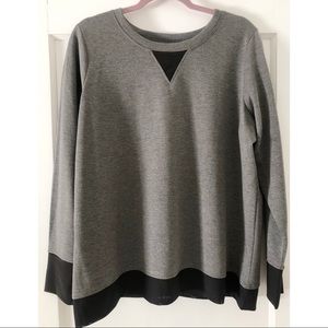 Sweater with mesh paneling